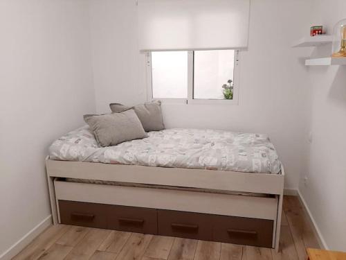 Ένα ή περισσότερα κρεβάτια σε δωμάτιο στο Confortable apartamento en Elche