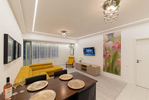 Uma TV ou centro de entretenimento em Smile Apartments