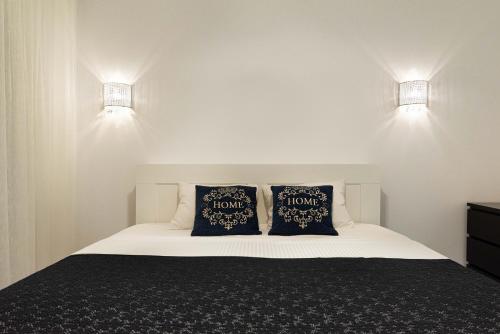 Cama ou camas em um quarto em Smile Apartments