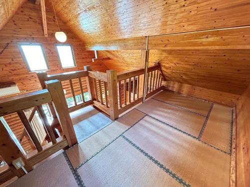 an overhead view of a room in a wooden cabin at Tokashiki Guest House in Tokashiki