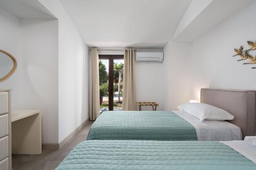 Ένα ή περισσότερα κρεβάτια σε δωμάτιο στο Harmony Luxury Private Villas