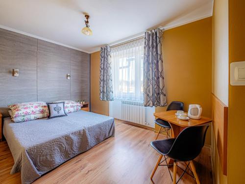 Кровать или кровати в номере WERONIKA Murzasichle