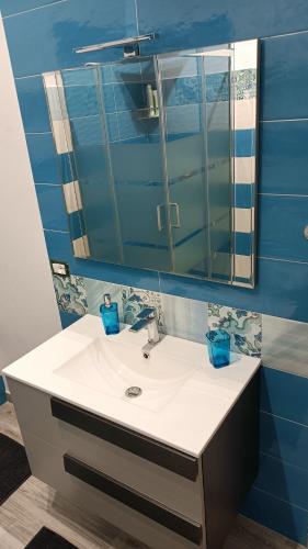 a bathroom with a sink and a mirror at Il tramonto in Balestrate