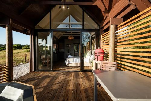 an open porch of a house with glass doors at Kragga Kamma Game Park in Port Elizabeth