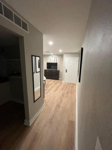 an empty living room with a hard wood floor at Steps to Aksarben Village, Walk to UNO in Omaha