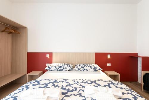Кровать или кровати в номере La Perla del Mare Rooms