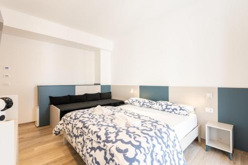 Кровать или кровати в номере La Perla del Mare Rooms