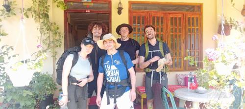 a group of people standing in front of a house at Vegetable Garden House in Adams Peak