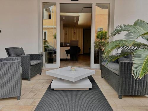 a living room with two couches and a coffee table at Bonsai in Tropea