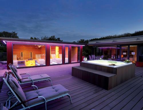 a house with a hot tub on a deck at FAVORITE Parkhotel in Mainz