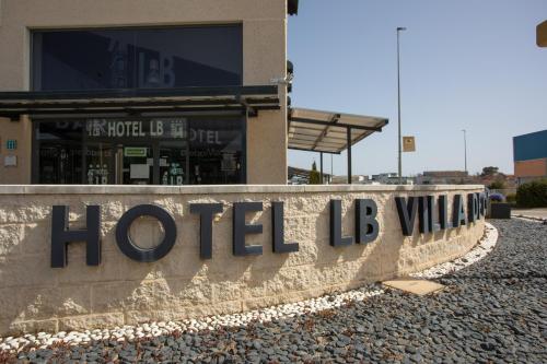 a hotel b sign in front of a building at Hotel LB Villa De Cuenca in Cuenca