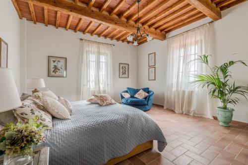 Ένα ή περισσότερα κρεβάτια σε δωμάτιο στο Villa del Nonno, Luxury Tuscan Farmhouse with Pool