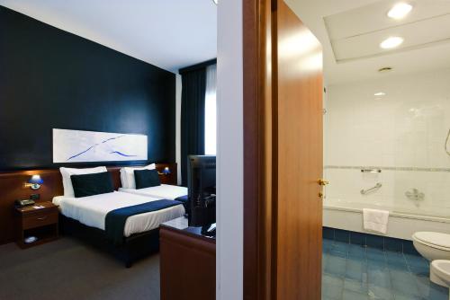 Katil atau katil-katil dalam bilik di Grand Hotel Tiberio