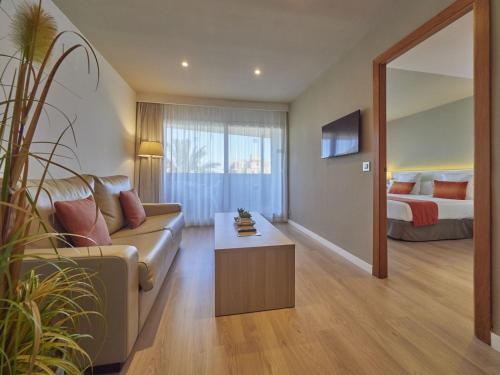 a living room with a couch and a bed at BQ Augusta Hotel in Palma de Mallorca