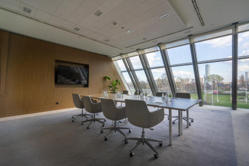 a conference room with a long table and chairs at Crowne Plaza Belgrade by IHG in Belgrade