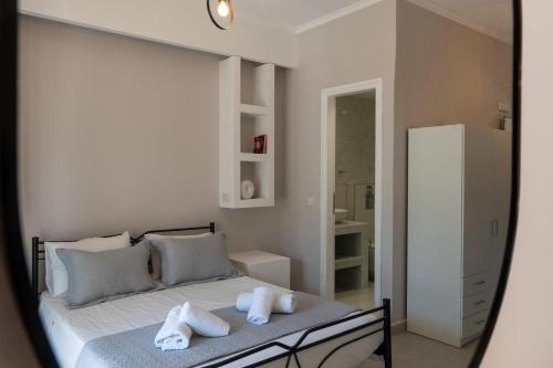a bedroom with a bed with towels on it at SkyBlue Horizon Studio 2 in Tsilivi
