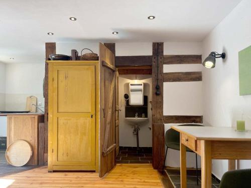 a room with a wooden door and a table at grün in grün in Detmold