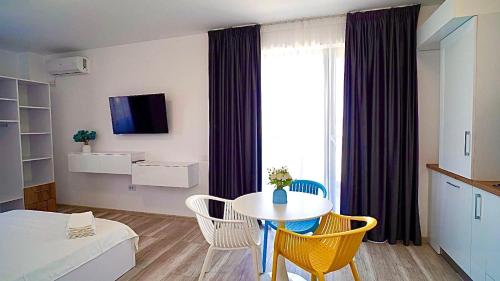 Televizorius ir (arba) pramogų centras apgyvendinimo įstaigoje Mamaia-Nord Boutique Apartments