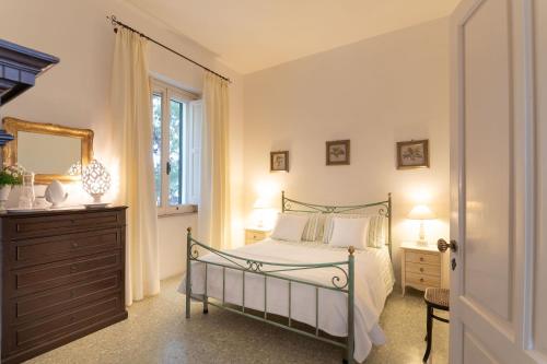 La Masseria by Masseria San Nicola Savelletri tesisinde bir odada yatak veya yataklar