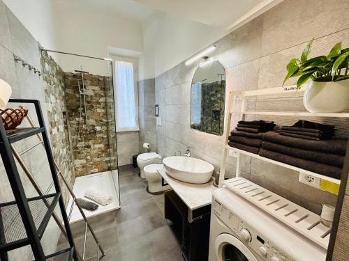 a bathroom with a sink and a toilet and a shower at Prati di Borgo in Rome