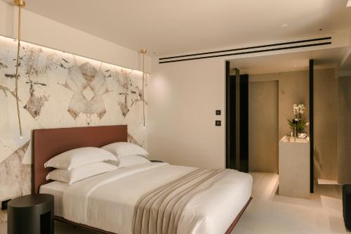 Ένα ή περισσότερα κρεβάτια σε δωμάτιο στο Casaly Hotel & Spa
