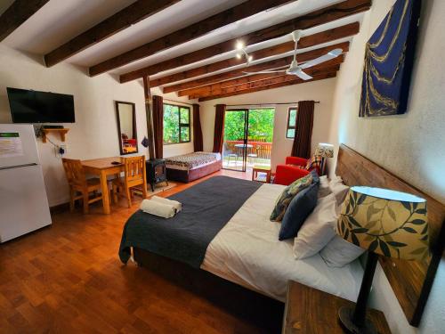 a bedroom with a large bed in a room at Pine Valley in Lanseria