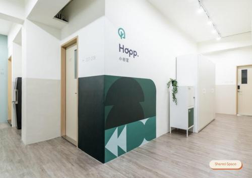 a hallway of an office with a sign on the wall at Lin Suites by Olala Homes in Taipei