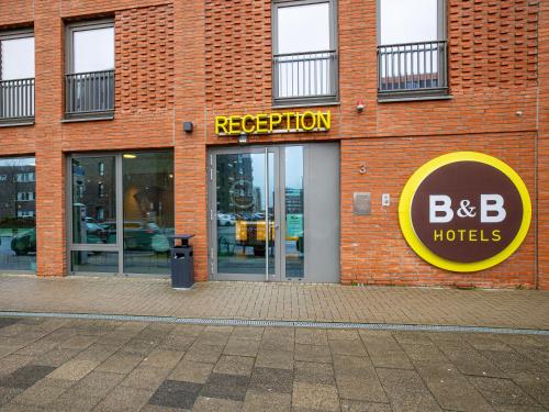 a large brick building with aba reception at B&B Hotel Bremerhaven in Bremerhaven