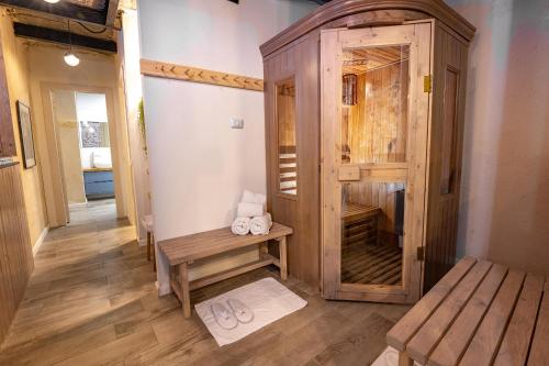 a room with a wooden closet with slippers in it at ארגמן סוויטות בוטיק in Safed