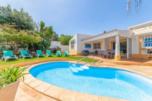 a swimming pool in the backyard of a house at Villa Dreams by Algarve Vacation in Guia
