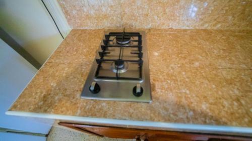 a stove top oven sitting on top of a counter at Tembo Oceanic Apartments in Malindi