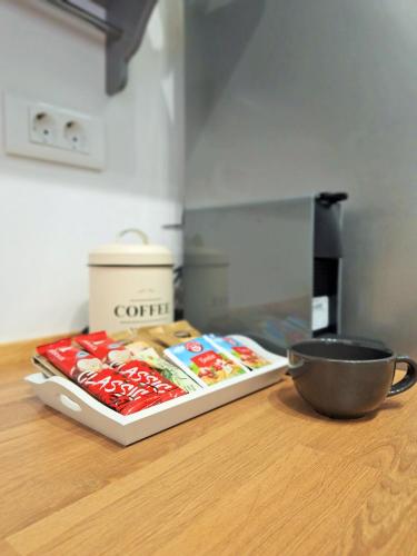 a counter top with a tray of food and a bowl at Blue Promenade Apartments in Dubrovnik