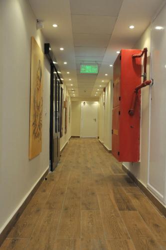 an empty hallway in a hospital with a hard wood floor at Salma Hotel Cairo in Cairo