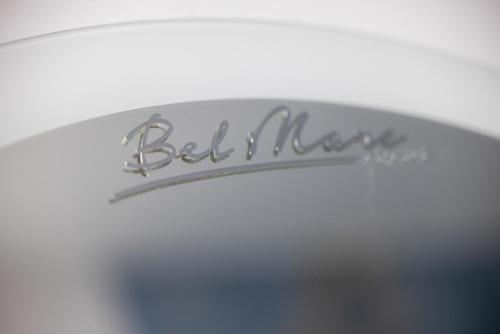 a silver sign that says belkin on a table at Sun & Beach Apartments Bel Mare with Parking by Noclegi Renters in Międzyzdroje