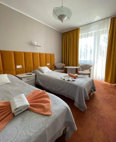 Ein Bett oder Betten in einem Zimmer der Unterkunft Damroka