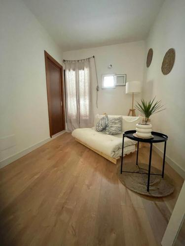a living room with a bed and a table at Casa Mia in Mola di Bari