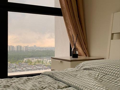 a bedroom with a bed and a large window at Lovely Eco Home in Gelang Patah
