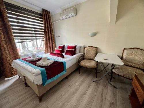 Ένα ή περισσότερα κρεβάτια σε δωμάτιο στο Happy Suite Boutique Hotel