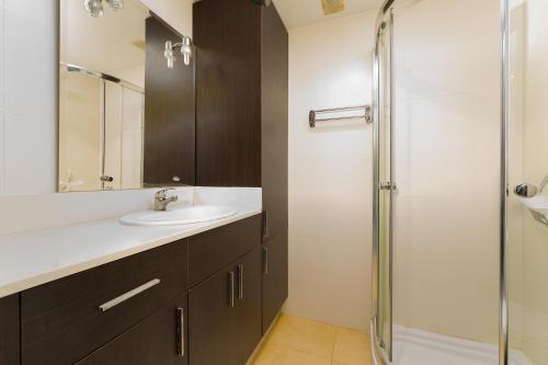 a bathroom with a sink and a shower at Port de Xabia V in Jávea