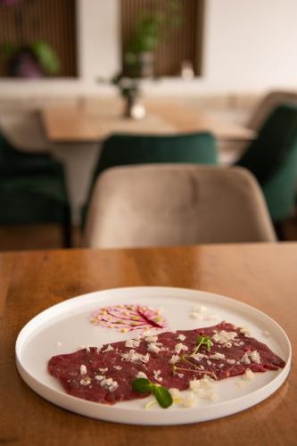 a plate of food sitting on a table at Hotel Marina in Fažana