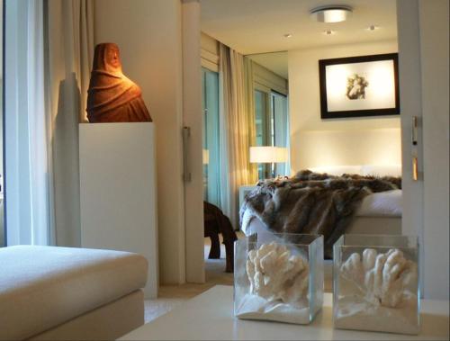 a bedroom with a bed and a table in a room at casagratia in Taormina