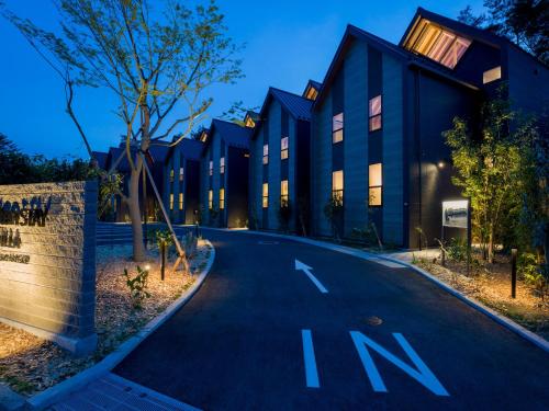 an empty road in front of a building at Rakuten STAY VILLA Kinugawa Riverside in Nikko