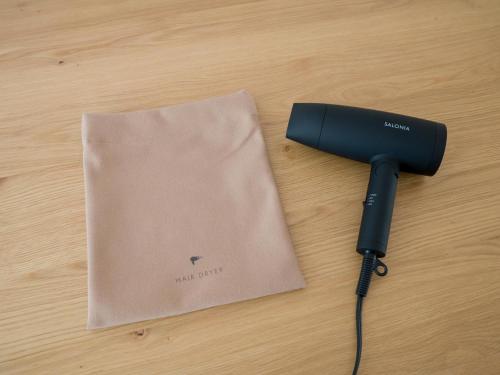 a camera sitting on a table next to a bag at Rakuten STAY VILLA Kinugawa Riverside in Nikko