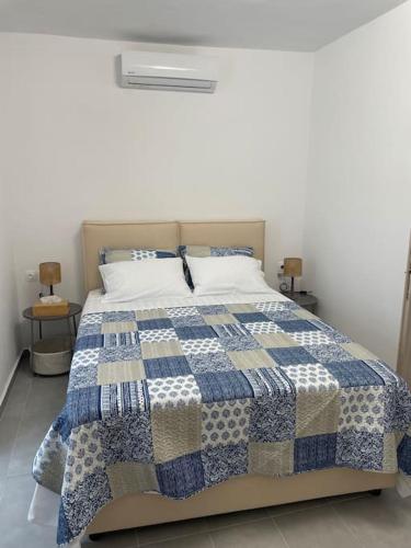Postel nebo postele na pokoji v ubytování Ether Hydra-Aesthetic Residence