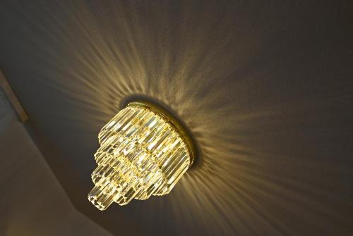 a chandelier hanging from a ceiling in a room at Hotel Zehnthof in Cochem
