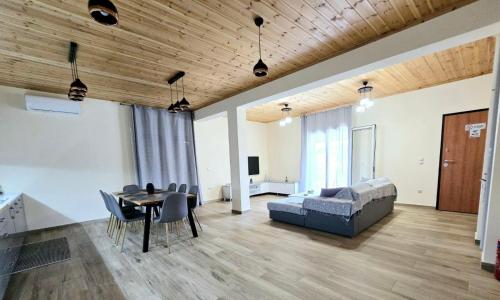 a living room with a couch and a table at Philoxenia guest house in Himare