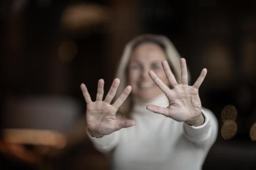 a woman with her hands in the air at Grischa - Das Hotel Davos in Davos