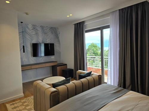 Postel nebo postele na pokoji v ubytování Perla Hotel