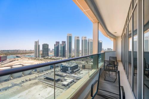 a balcony with a view of the city at Silkhaus Vacation Homes Chic 2BDR Near Reem Mall in Abu Dhabi