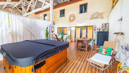 a large room with a large grill in a house at La Grange des Anges in Blanc